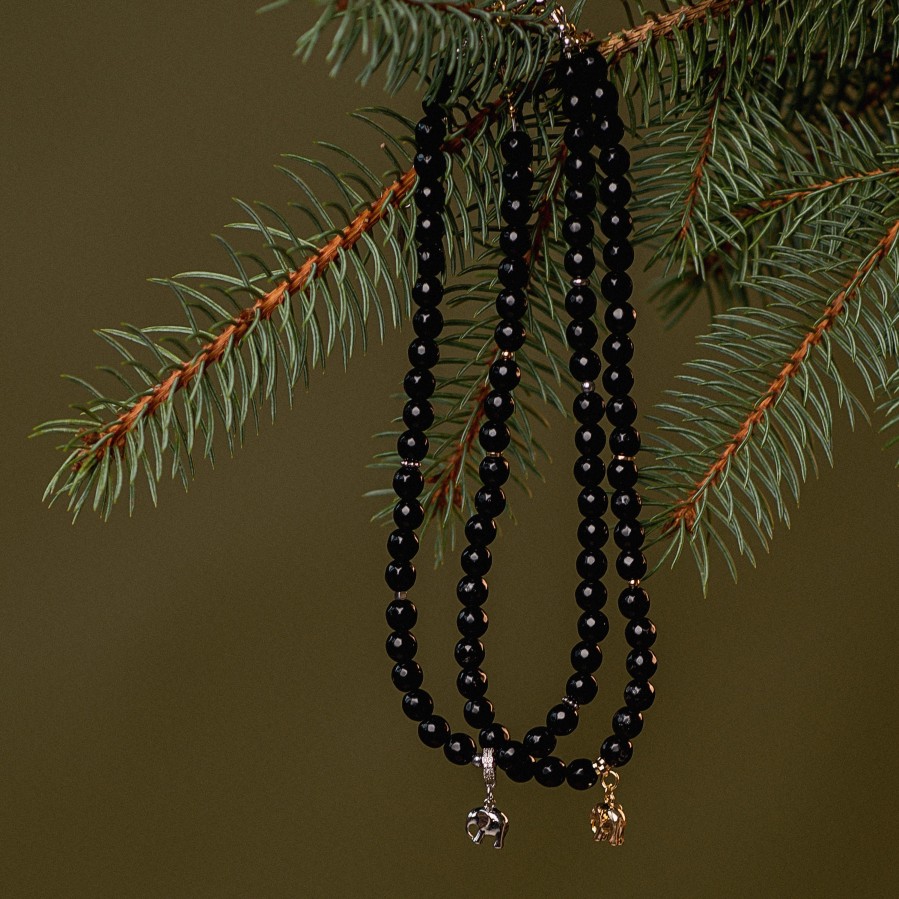 Facetuoto onikso vėrinys su aukso ar sidabro spalvos drambliuku (TMVER20) 